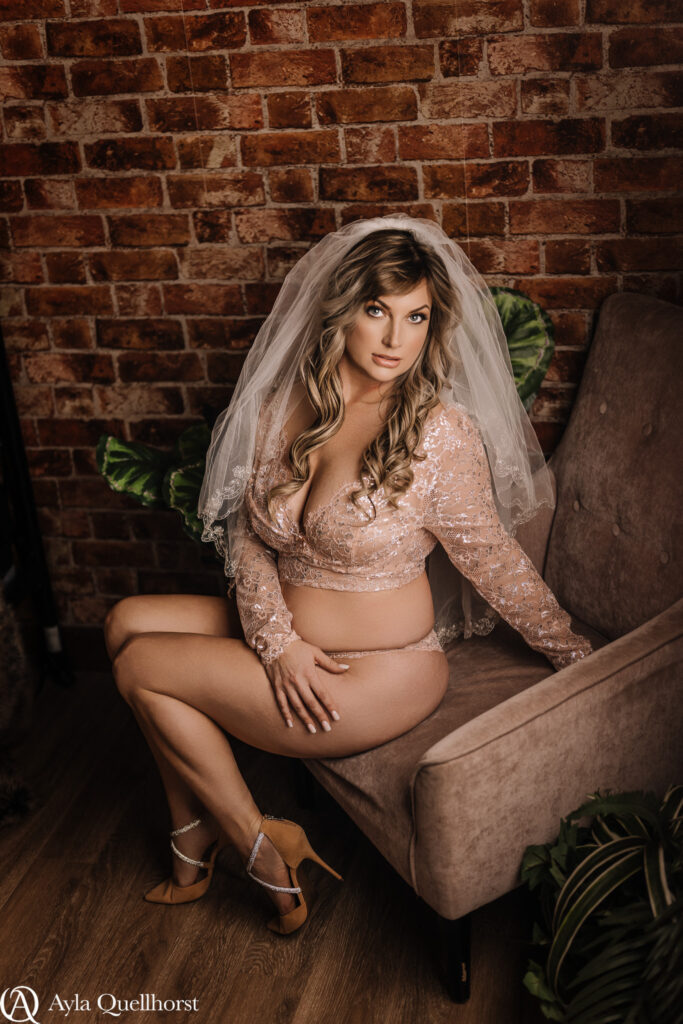 Bride in white veil with moody studio lighting